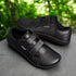black velcro leather barefoot minimalist shoes on a rock