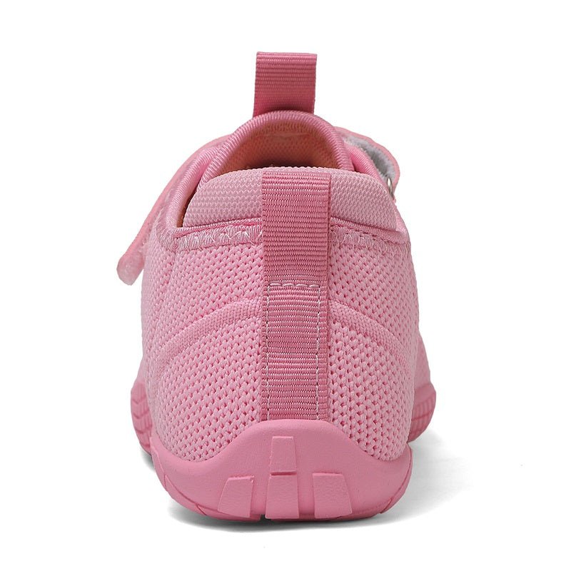 pink barefoot sneaker for kids with a strap back view