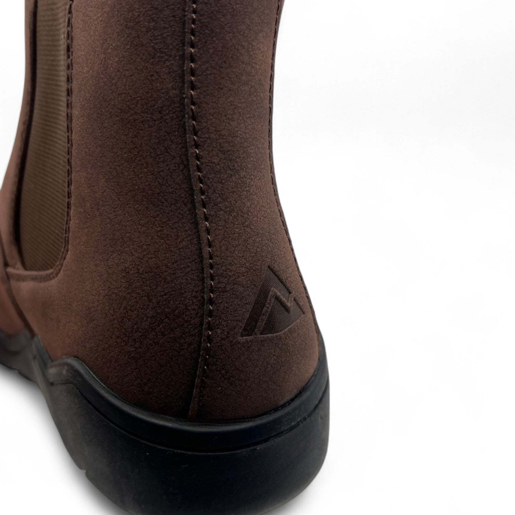 Close-up of a brown leather boot with a brand logo on a white background