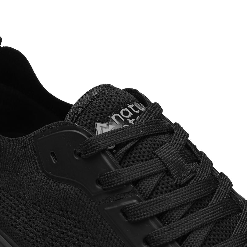 Detail of breathable knit upper and laces on Aramid Contact 3.0 barefoot shoes in black