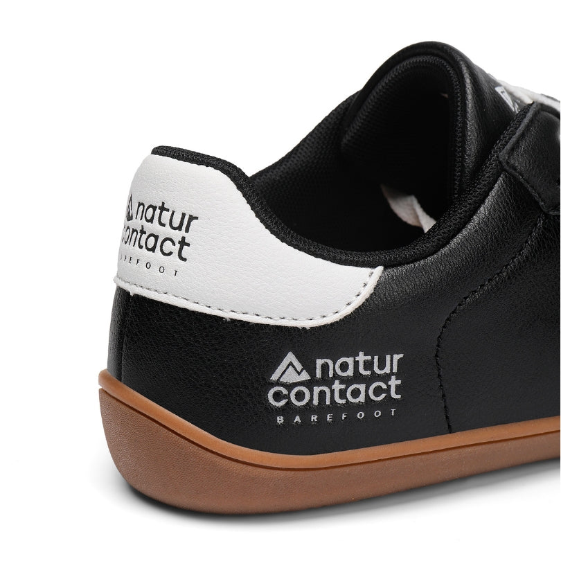 Heel logo detail of Barefoot Walker Leather black minimalist barefoot shoes