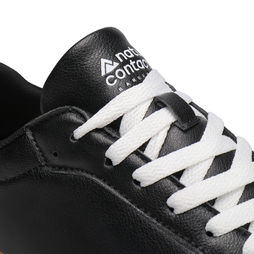 Lace and tongue detail of Barefoot Walker Leather black barefoot shoes