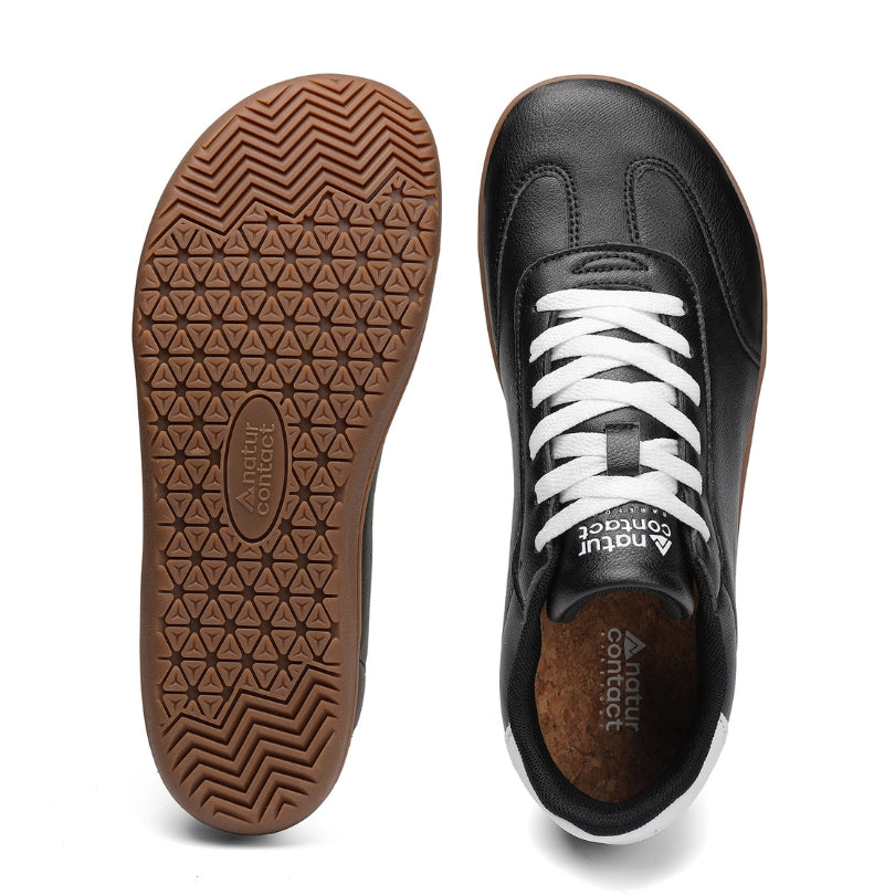 Barefoot Walker Leather black barefoot shoes showing flexible sole and wide toe box