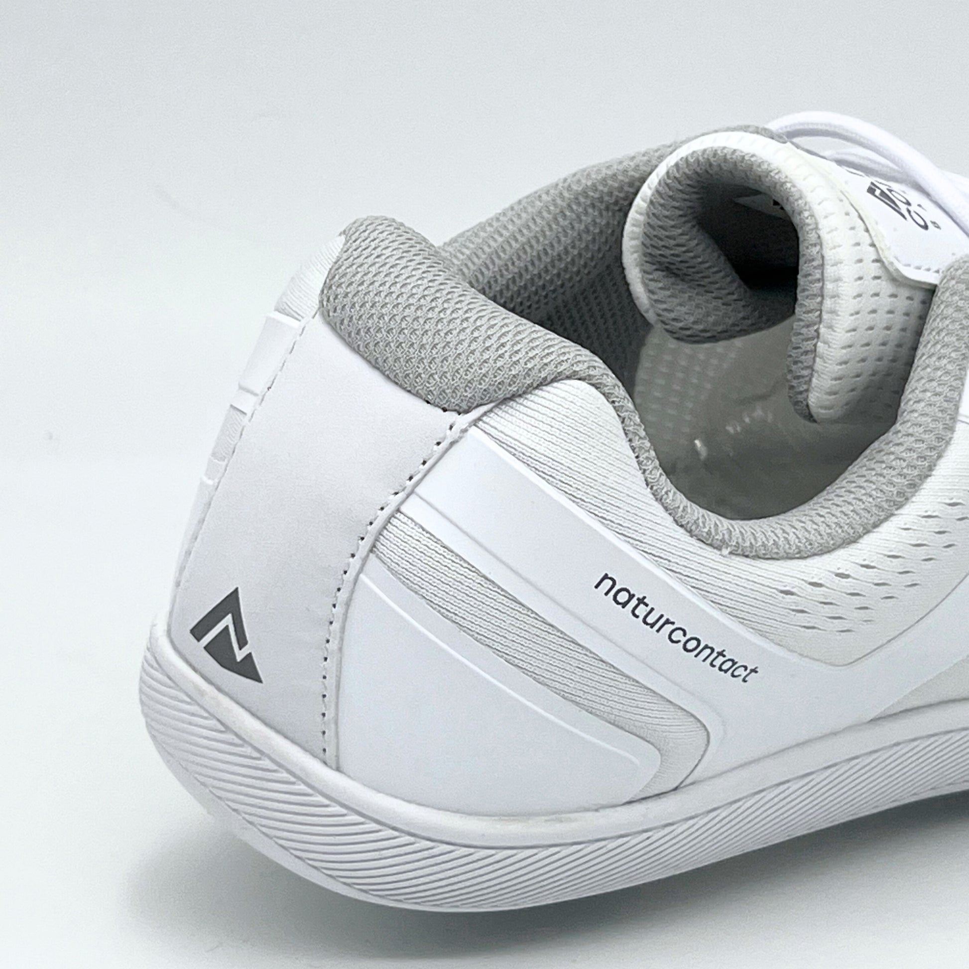 white daily barefoot shoes with details of the back of the shoe with logo