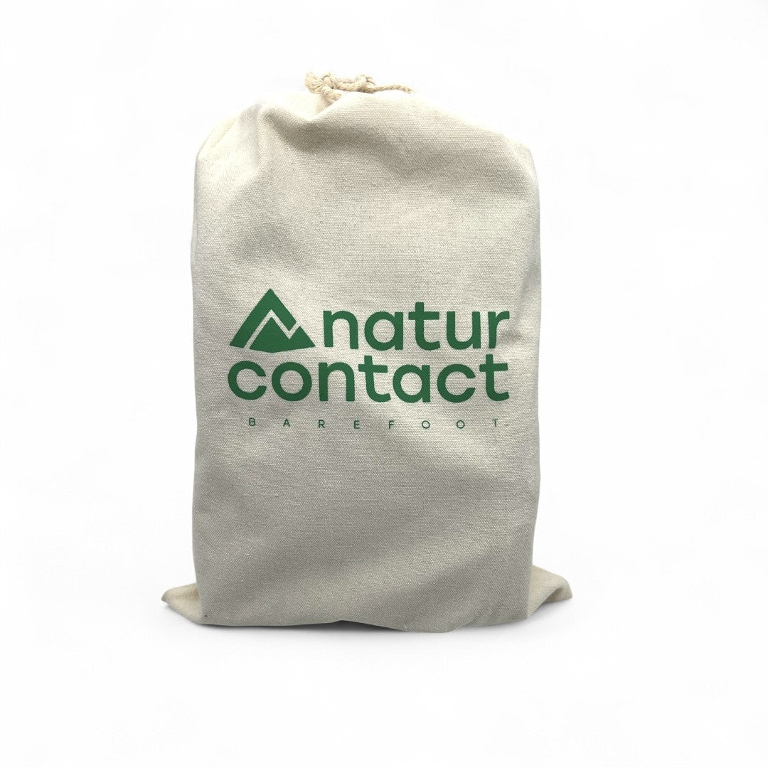 Beige drawstring bag with 'naturcontact' branding on a white background