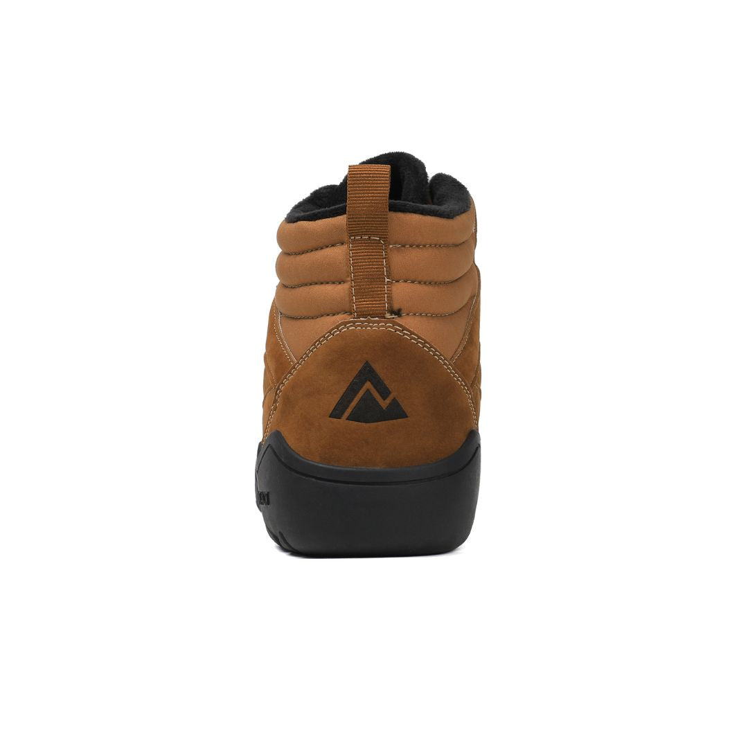 Gold winter barefoot shoe with black laces on a white backgroundì, rear view.