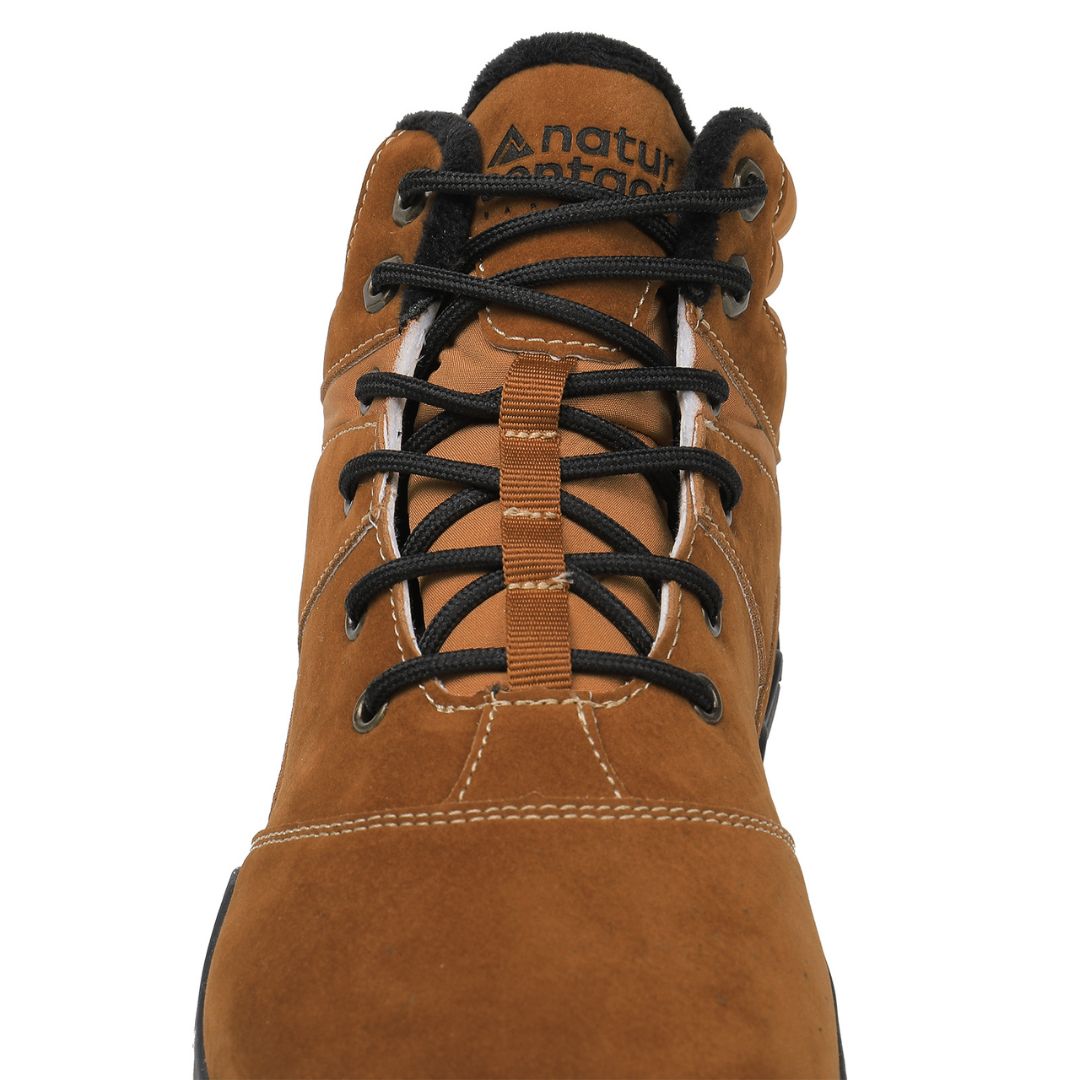Gold winter barefoot shoe with black laces on a white background, featuring 'Naturcontact' branding. sole view.

