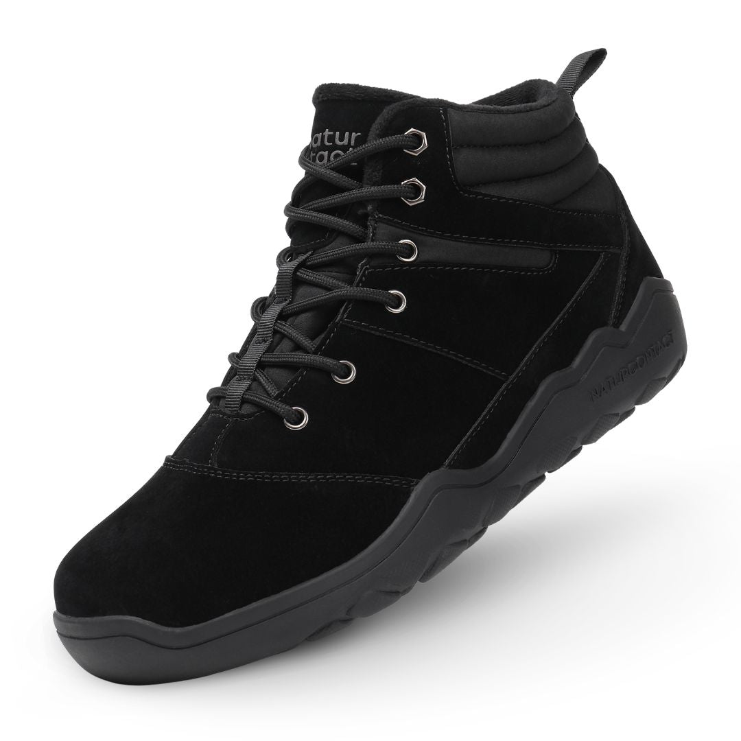 Black winter barefoot shoe with black laces on a white background, featuring 'Naturcontact' branding. angled side view.
