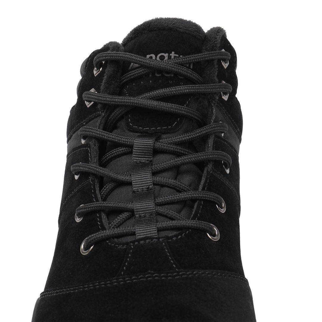 Black winter barefoot shoe with black laces on a white background, featuring 'Naturcontact' branding. close-up front view.