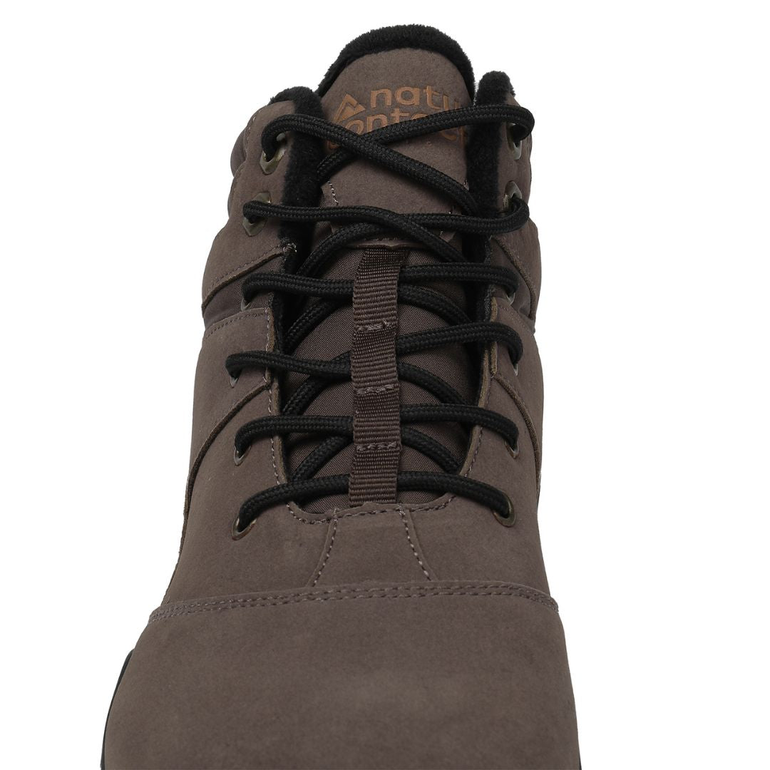 Dark brown winter barefoot shoe with black laces on a white background, featuring 'Naturcontact' branding. close-up front view.