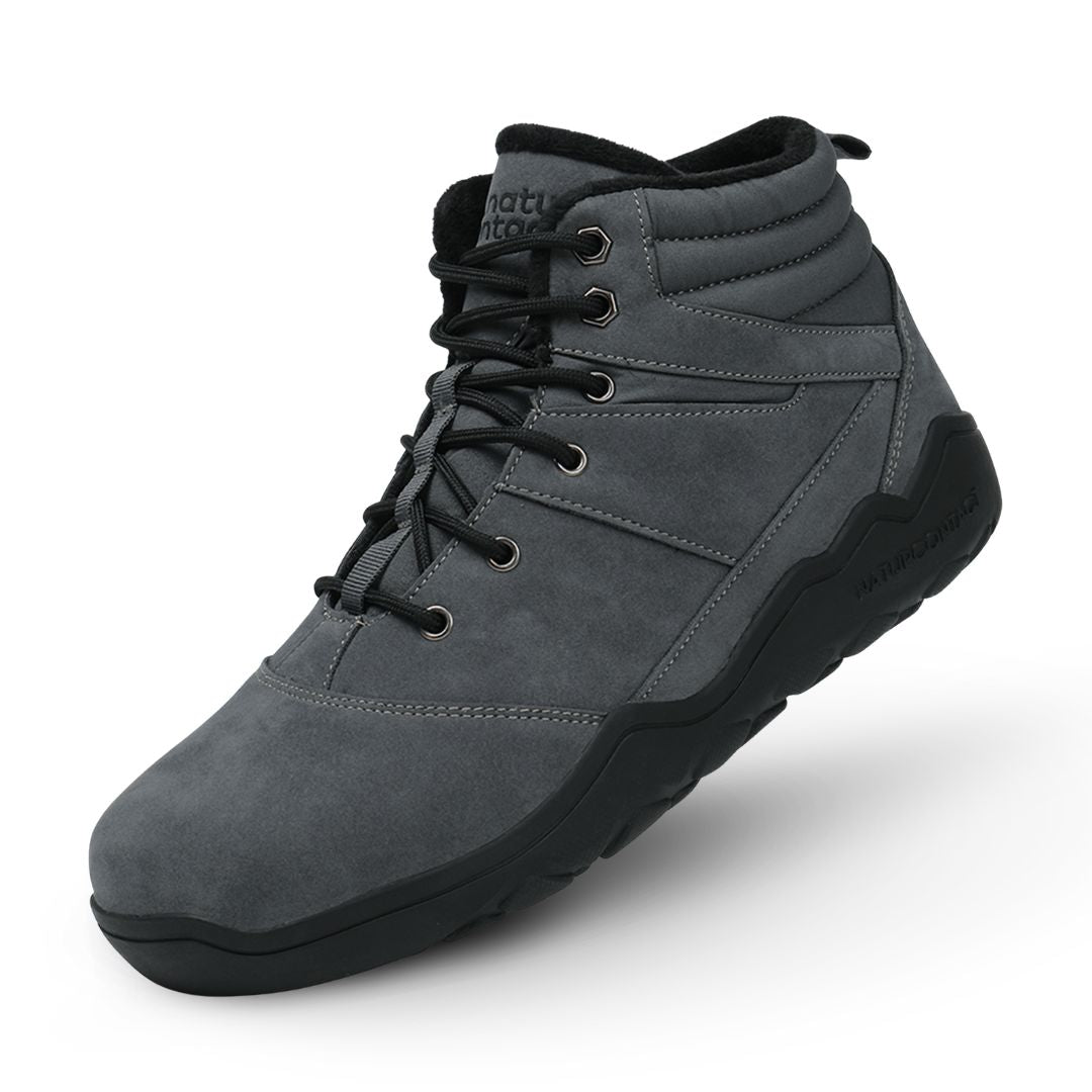 Grey winter barefoot shoe with black laces on a white background, featuring 'Naturcontact' branding. angled side view.