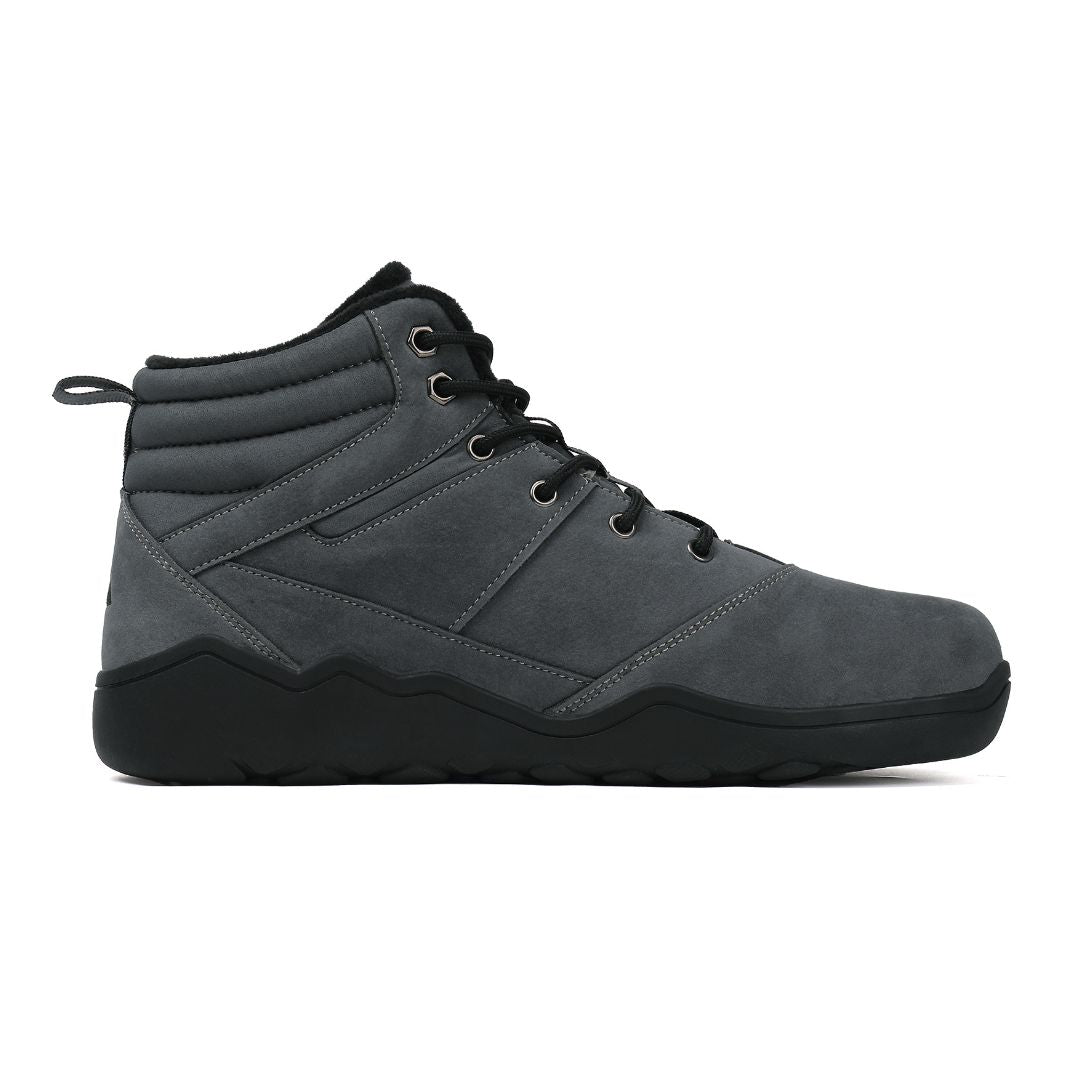 Grey winter barefoot shoe with black laces on a white background, right side view.