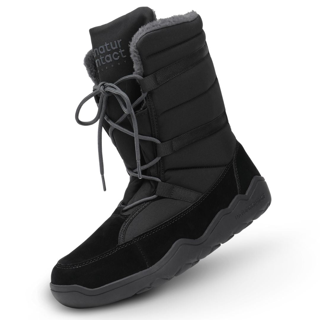 Black winter boot with fur lining on a white background