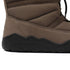 Brown winter boot with black sole on a white background