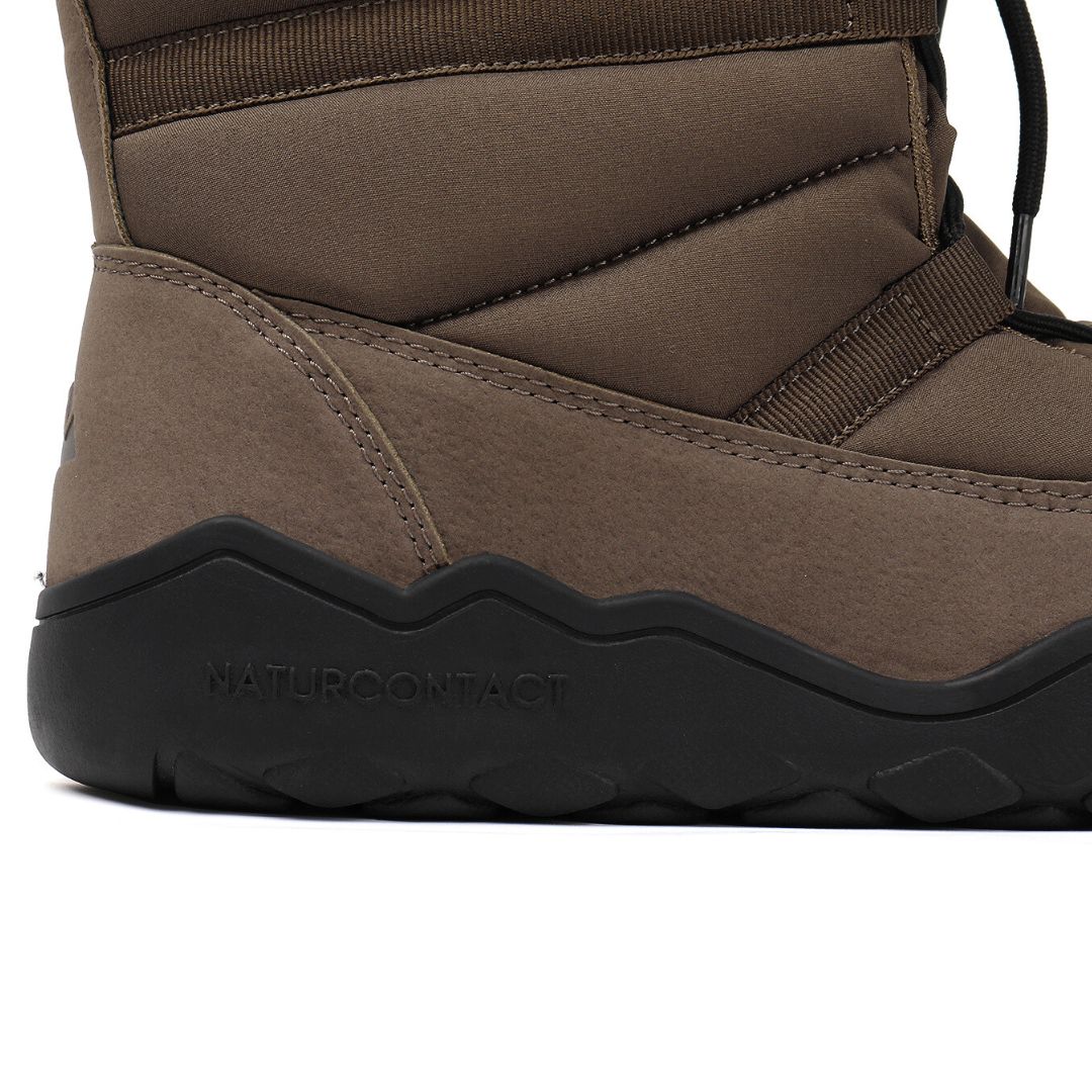 Brown winter boot with black sole on a white background