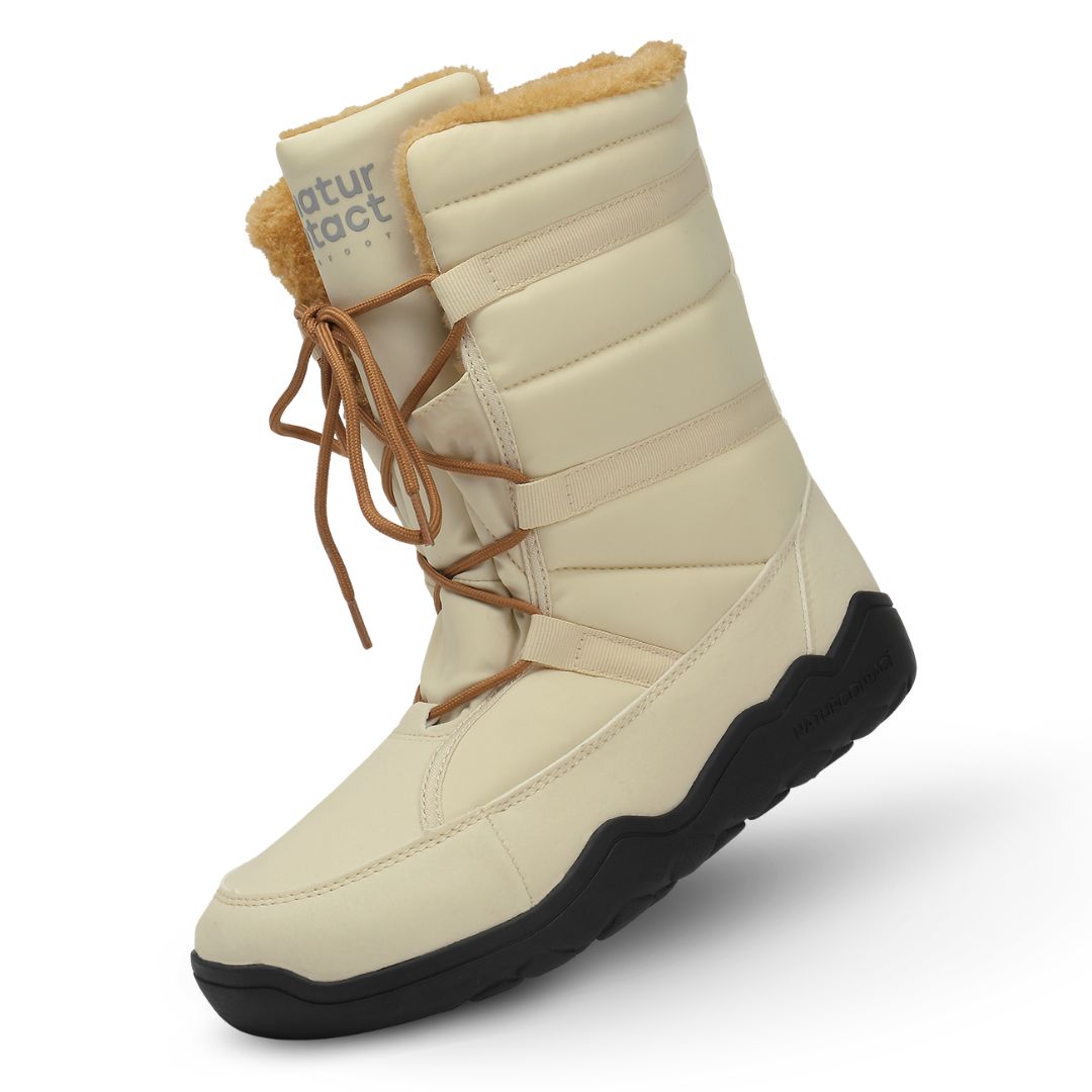Beige winter boot with brown laces and black sole on a white background