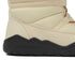 Close-up of a beige winter boot with a black sole on a white background