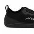 Close-up of black Naturcontact Aramid Contact 2.0 barefoot trainers showing the black laces, tongue emblem and breathable knitted fabric.