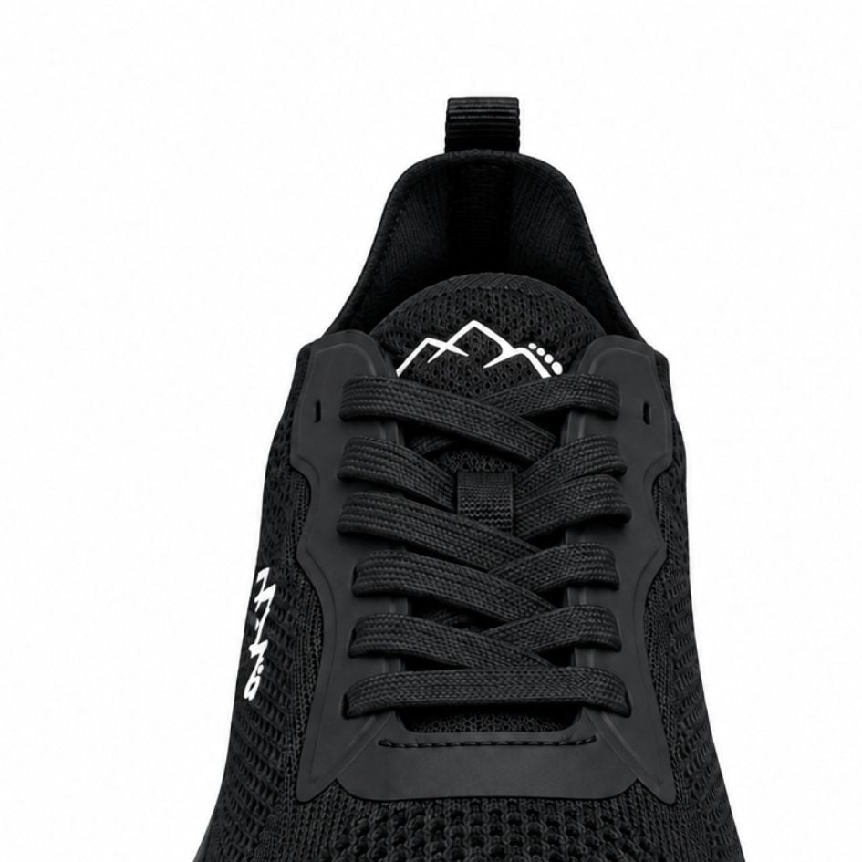 Close-up of the black Aramid Contact 2.0 heel and side showing the mesh upper, heel pull loop and white mountain logo.