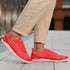 Naturcontact Aramid Contact 3.0 barefoot shoes in coral red worn for everyday walking with flexible minimalist sole