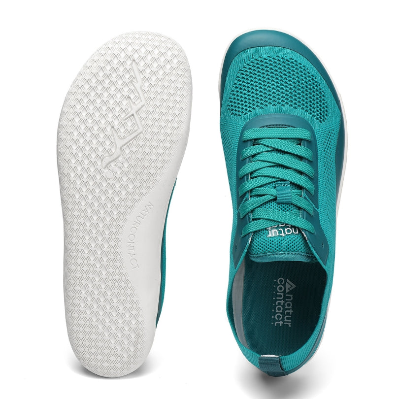 Teal barefoot running shoe with wide toe box and white sole on a white background