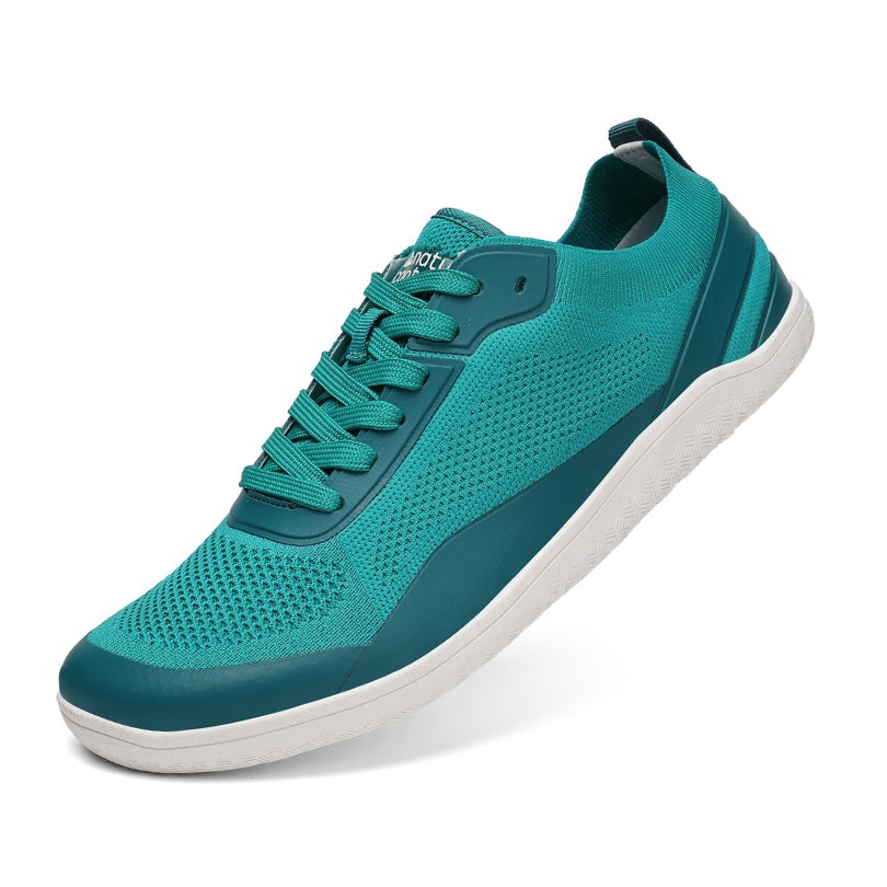 Teal barefoot sneaker with white sole on a white background