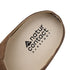Close-up of a barefoot suede clog sole with 'natur contact barefoot' logo on a white background