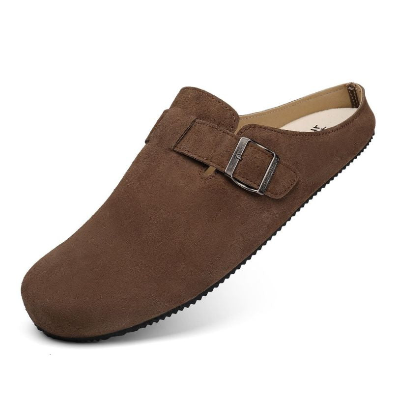 Brown suede barefoot clog shoe with a buckle on a white background