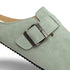 Green barefoot suede clog shoe with a buckle with naturcontact logo on a white background