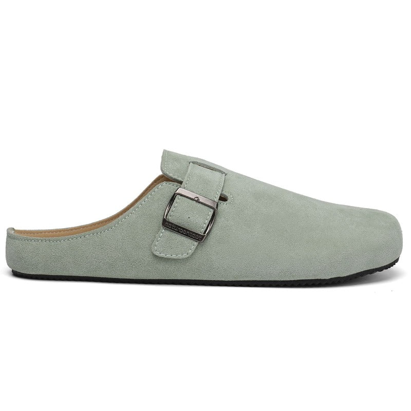 sage green barefoot suede clog with a buckle on a white background side view