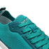 detail of Teal barefoot athletic shoe with brand logo on a white background