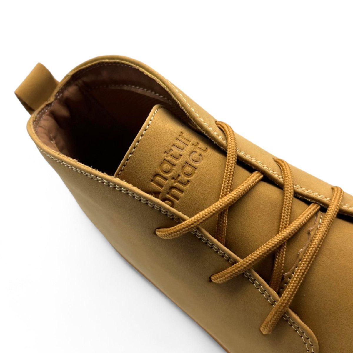 Detail of Naturcontact George Smart barefoot shoes in tan vegan leather showing logo and lacing area