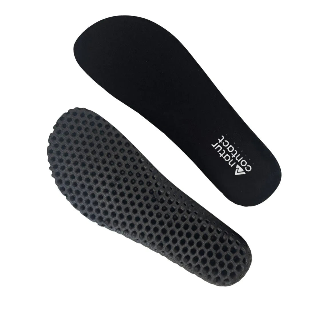 Honeycomb-textured black insoles for barefoot shoes with flexible black base and full-length perforated structure.
