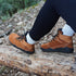Naturcontact Intemperia 2.0 winter barefoot boots worn outdoors on a forest trail, showing natural flexibility and grip during hiking