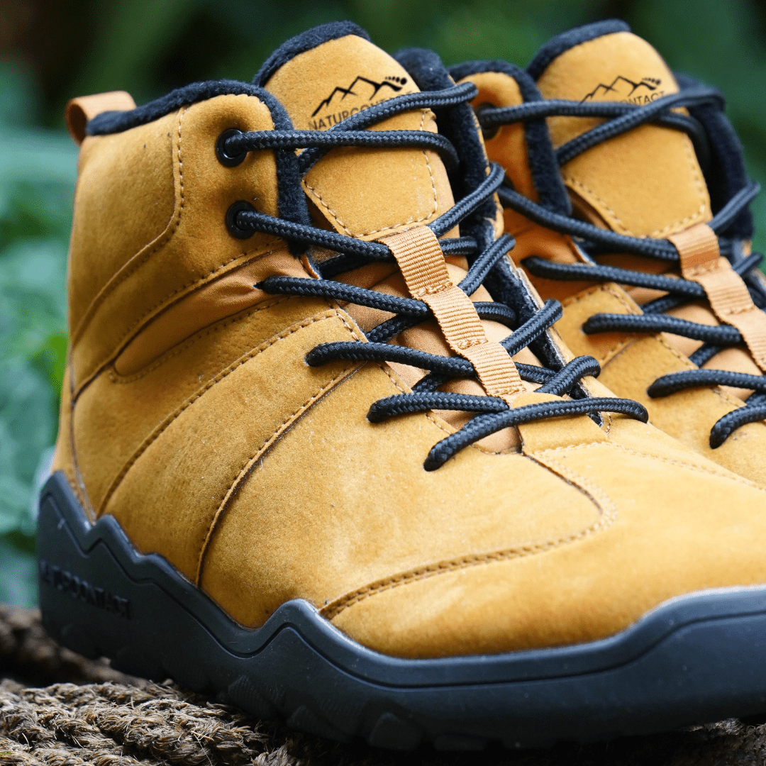 Close-up of Naturcontact Intemperia winter barefoot boots in Gold color, highlighting suede upper, padded collar and minimalist lacing system.