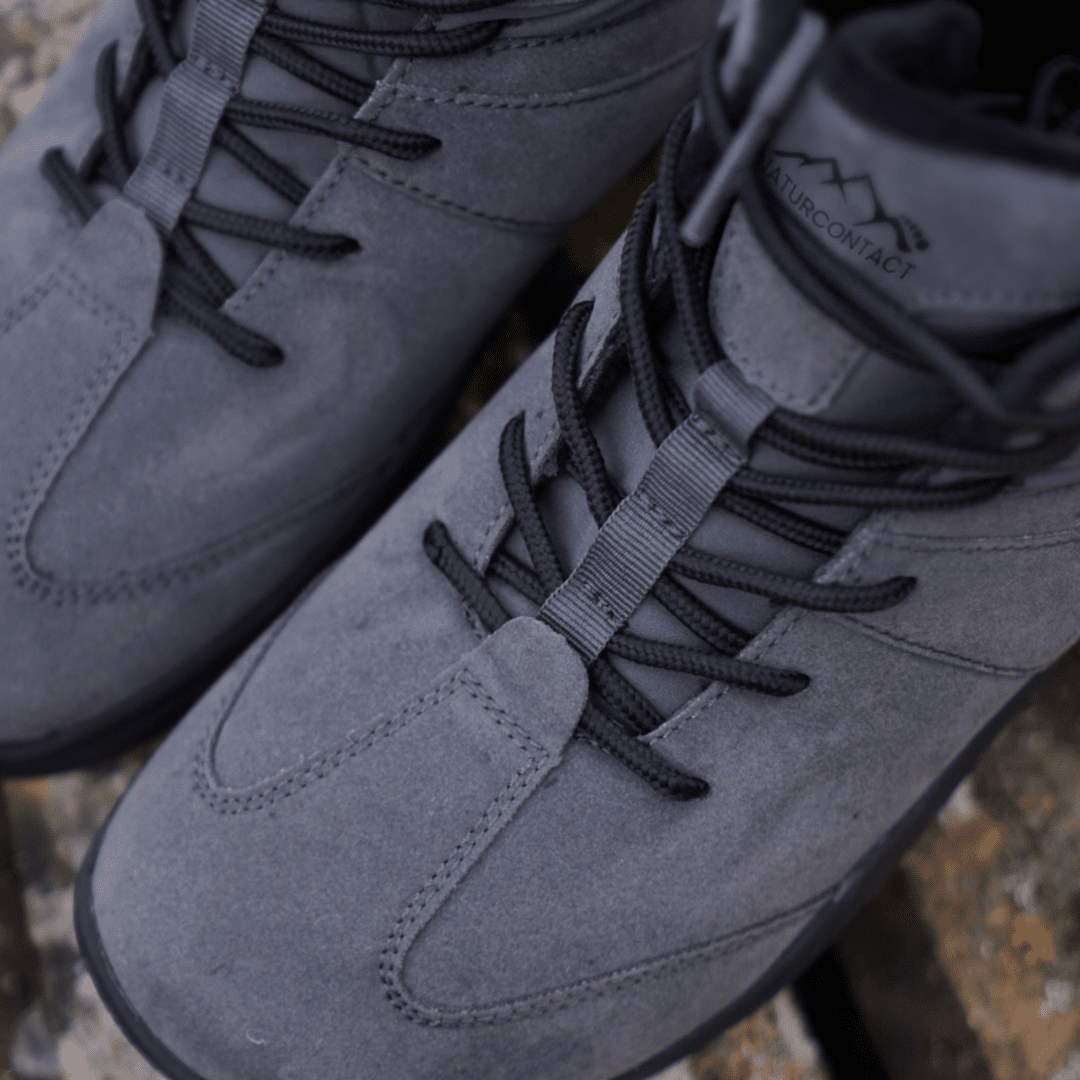 Close-up of Naturcontact Intemperia winter barefoot boots in Grey, focusing on the suede upper, reinforced stitching and minimalist lace system.