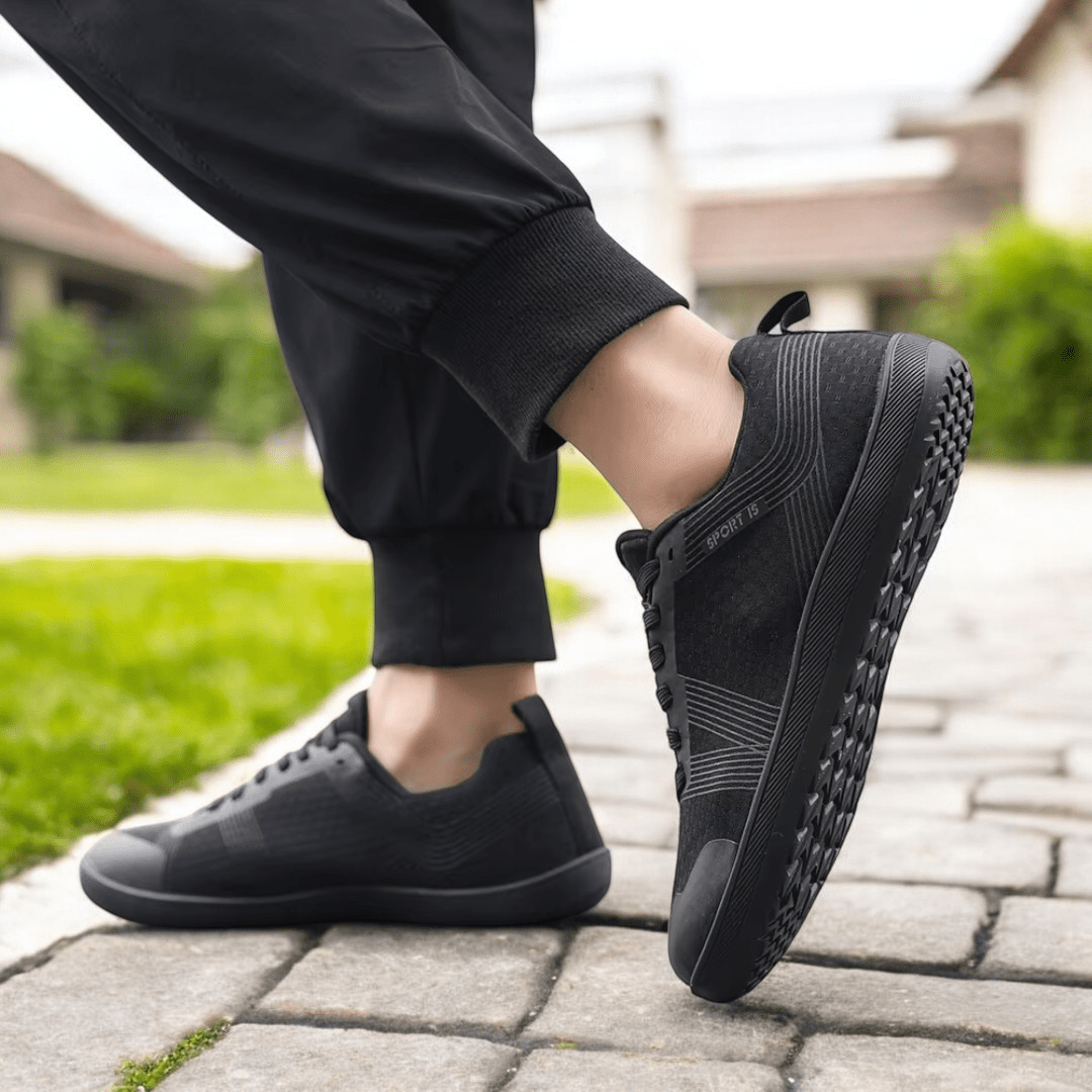 Naturcontact Metro Flex 2.0 barefoot shoes in black vegan leather worn outdoors showing flexible minimalist sole