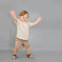 Naturcontact Mini Contact 2.0 baby barefoot shoes worn by toddler taking first steps, flexible sock-style design supporting balance, stability and natural foot development.