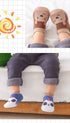 Naturcontact Mini Contact 2.0 baby barefoot shoes worn by toddler indoors, sock-style design with cute animal patterns, flexible non-slip sole supporting natural foot development.