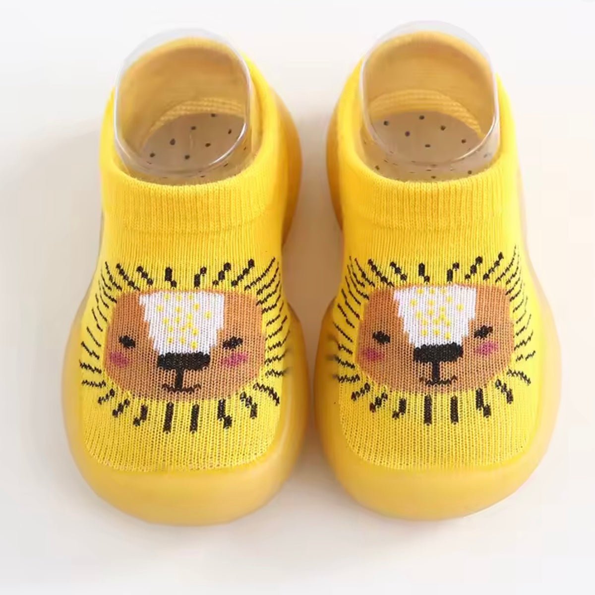 Naturcontact Mini Contact 2.0 baby barefoot shoes in yellow colorway, sock-style design with cute lion face, breathable fabric and flexible non-slip sole.