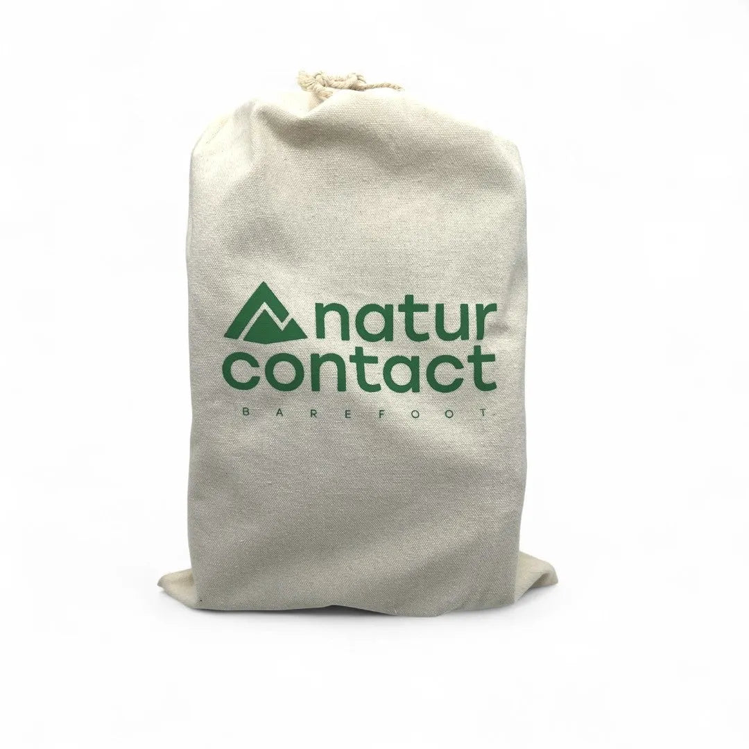 Naturcontact natural cotton drawstring bag with logo, front view on white background, used for storing barefoot shoes.
