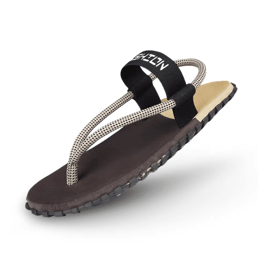 Naturwalkers barefoot sandals in brown colorway with thin minimalist sole, textured footbed, and rope toe-post straps.