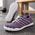 Lilac Sport Contact 2.0 barefoot shoes photographed as a pair, with the white outsole tread of one shoe visible.