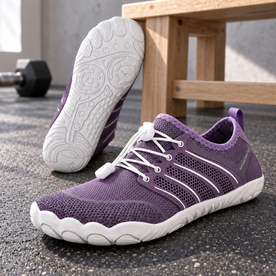 Lilac Sport Contact 2.0 barefoot shoes photographed as a pair, with the white outsole tread of one shoe visible.