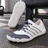 White and navy Sport Contact 2.0 barefoot shoes shown as a pair with a detailed view of the white outsole traction pattern.