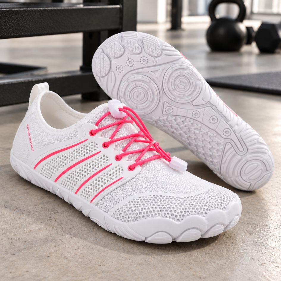 White and pink Sport Contact 2.0 barefoot shoes in a product setting, with one shoe displaying its white patterned outsole.