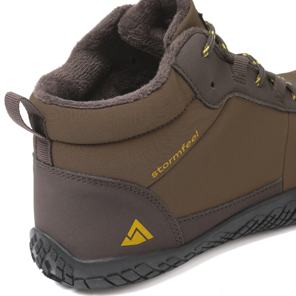 Close-up of the brown Storm Feel shoe showing its side panel, fleece collar and heel.