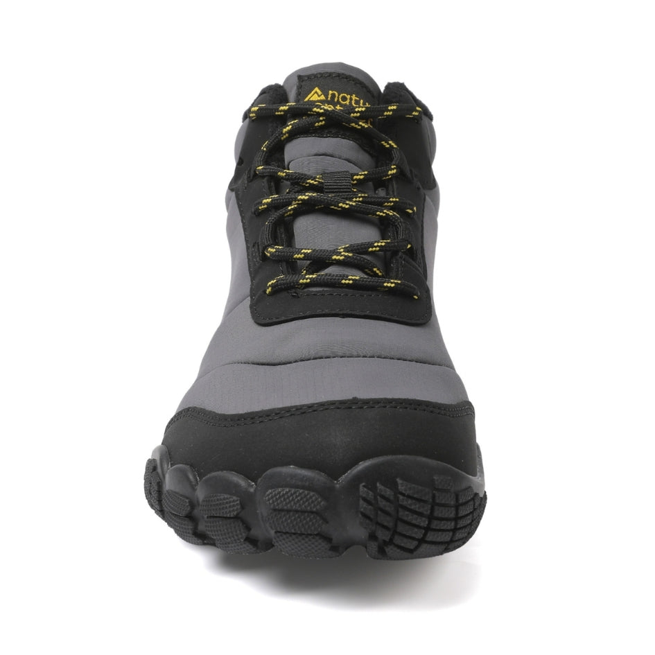 Front view of the grey Storm Feel shoe, showing its laces and wide toe box.