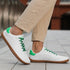 Naturcontact Walker Leather barefoot shoes in white and green worn for everyday walking with flat minimalist sole