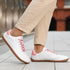 Naturcontact Walker Leather barefoot shoes in white and pink worn for everyday walking with flat minimalist sole